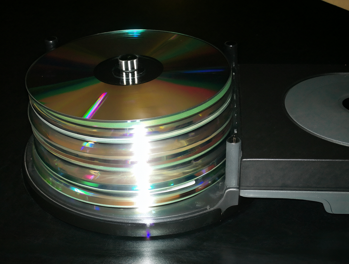 Stack of M-DISCs and optical drive