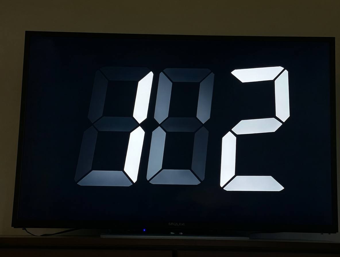 Reloj digital con números proporcional mostrando un ligero movimiento entre dígitos.