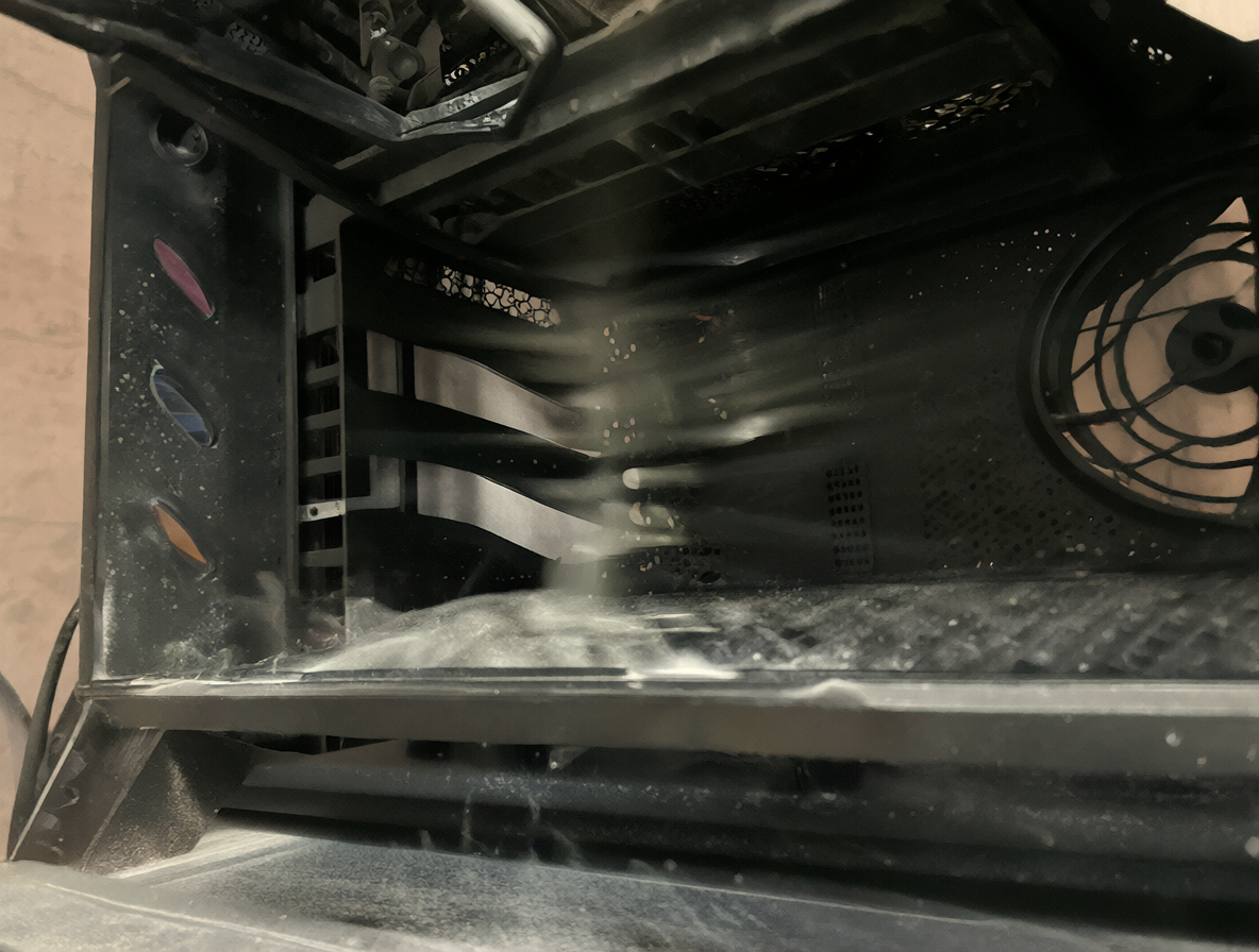 Gaming PC tower on a metal stand with airflow streams visible