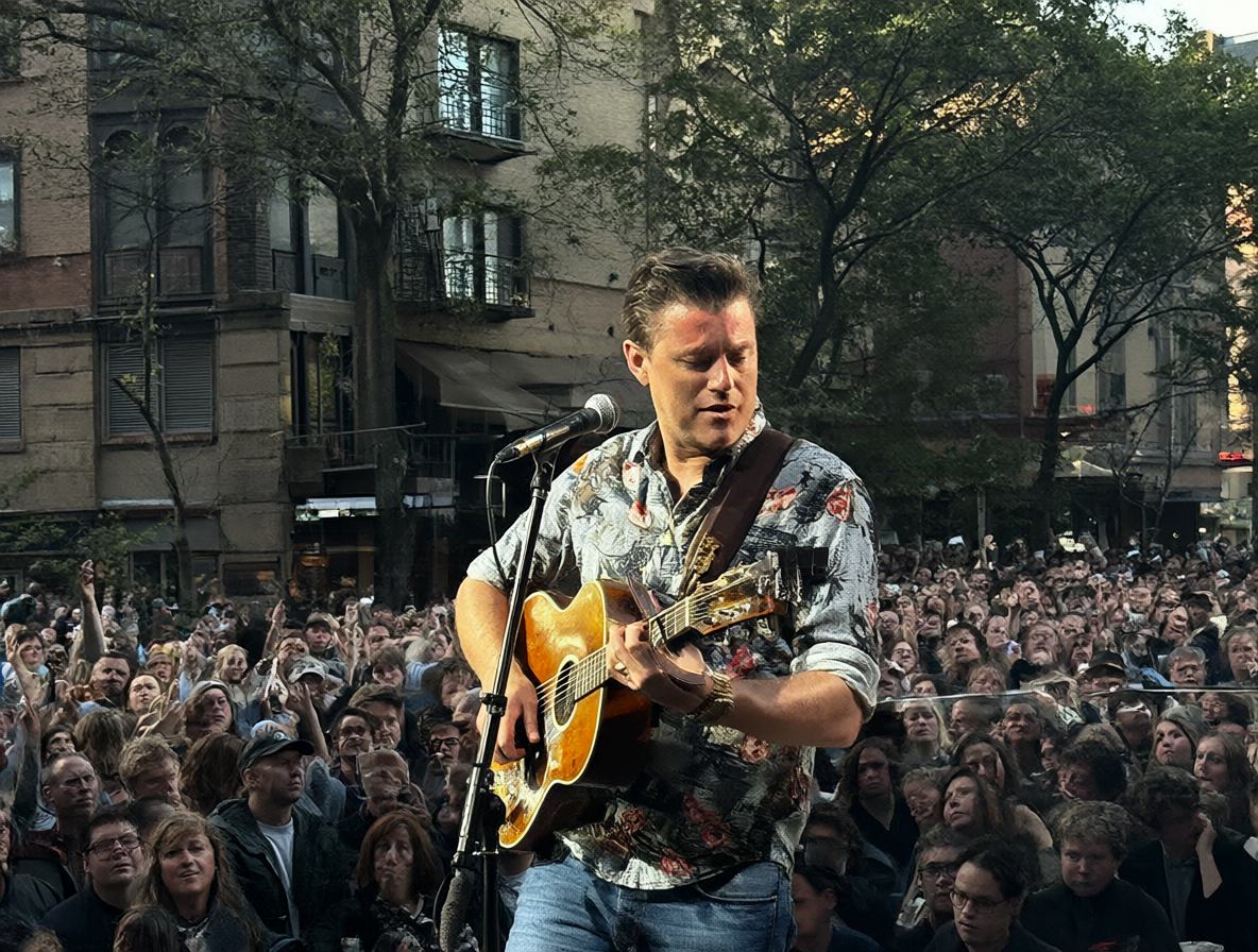 Foto de Kevin Johansen tocando la guitarra en vivo frente a una audiencia.