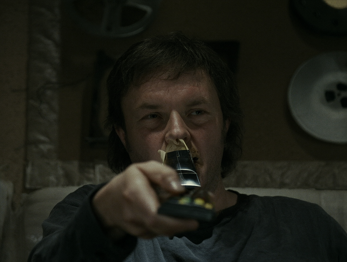 Killer rewinding the movie with a remote in Funny Games.