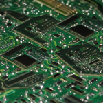 Macro shot of a graphics card PCB showing directly soldered VRAM chips with no expansion slots.